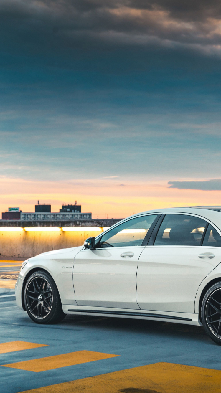 White Sedan on Road During Daytime. Wallpaper in 750x1334 Resolution