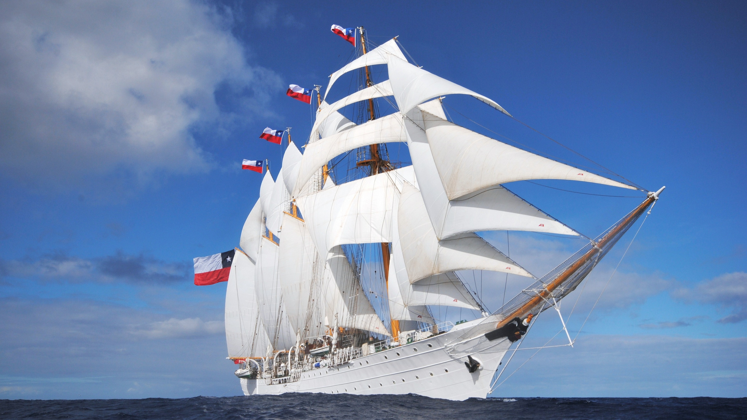 White Sail Boat on Sea Under Blue Sky During Daytime. Wallpaper in 2560x1440 Resolution