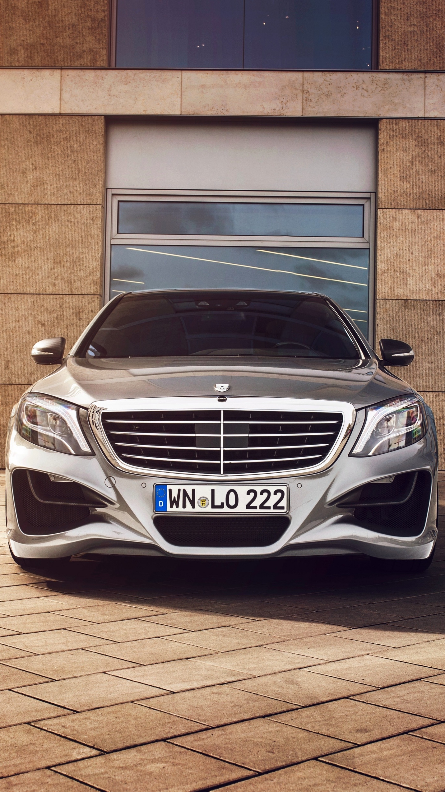 White Mercedes Benz Car Parked Beside Brown Brick Wall. Wallpaper in 1440x2560 Resolution