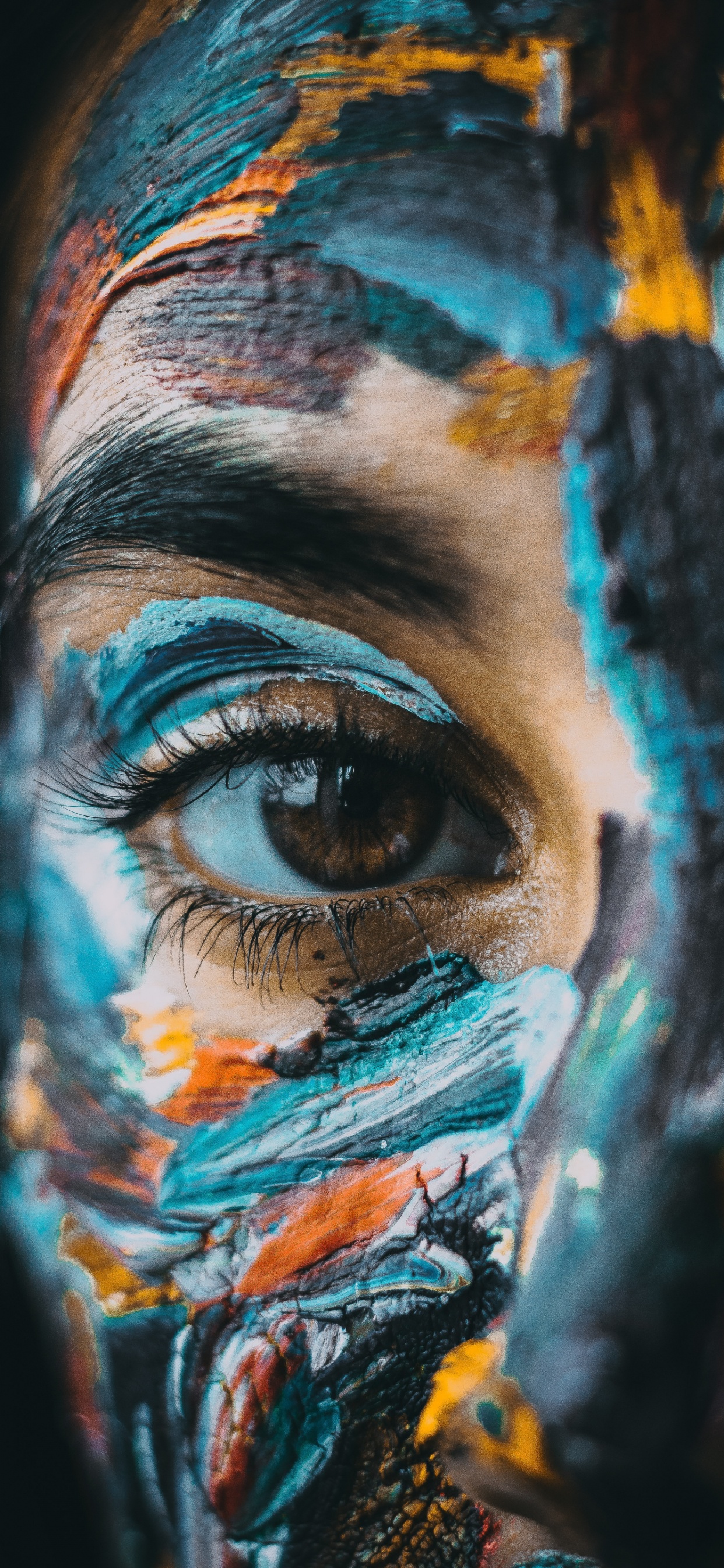 Person With Blue and Yellow Paint on Face. Wallpaper in 1242x2688 Resolution