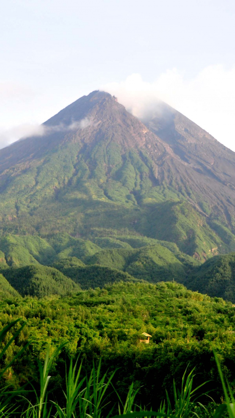 Green and Brown Mountain Under White Clouds During Daytime. Wallpaper in 750x1334 Resolution