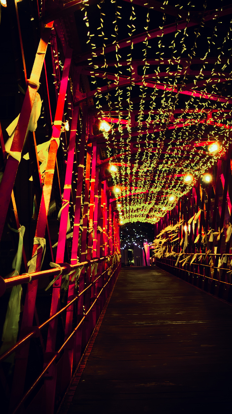 Red String Lights on Brown Wooden Bridge. Wallpaper in 750x1334 Resolution