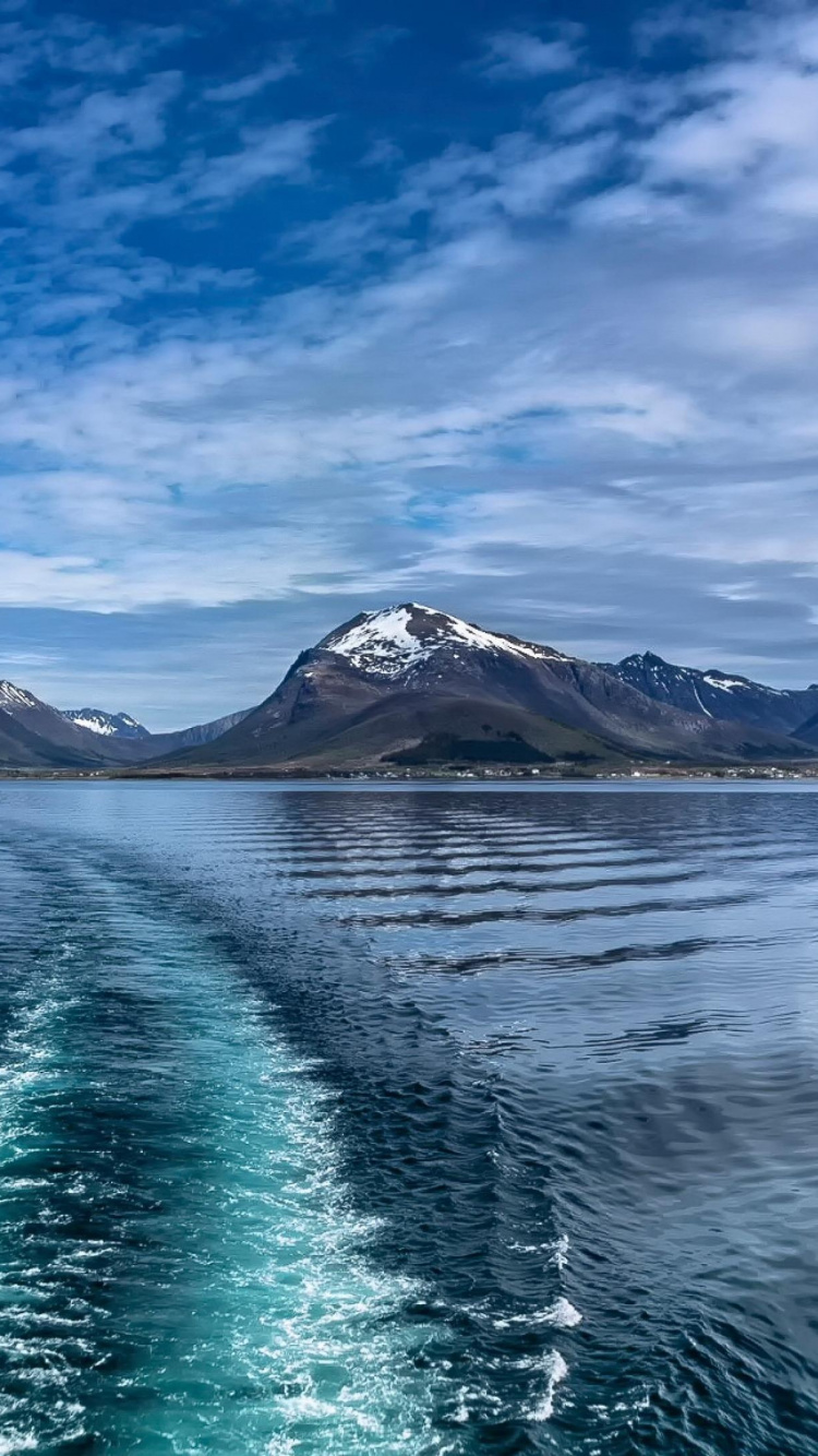 Body of Water Near Mountain Under Blue Sky During Daytime. Wallpaper in 750x1334 Resolution
