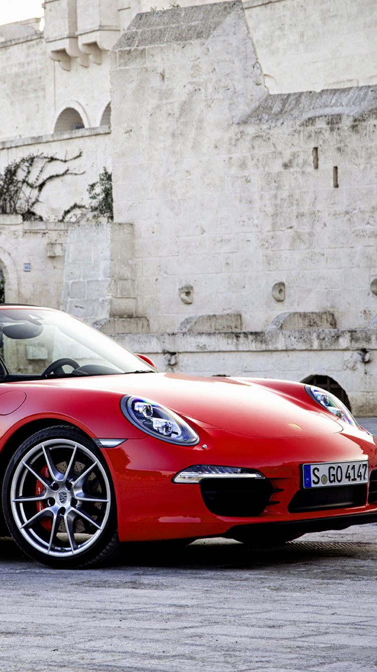 Red Ferrari 458 Italia Parked Near Gray Concrete Building During Daytime. Wallpaper in 750x1334 Resolution
