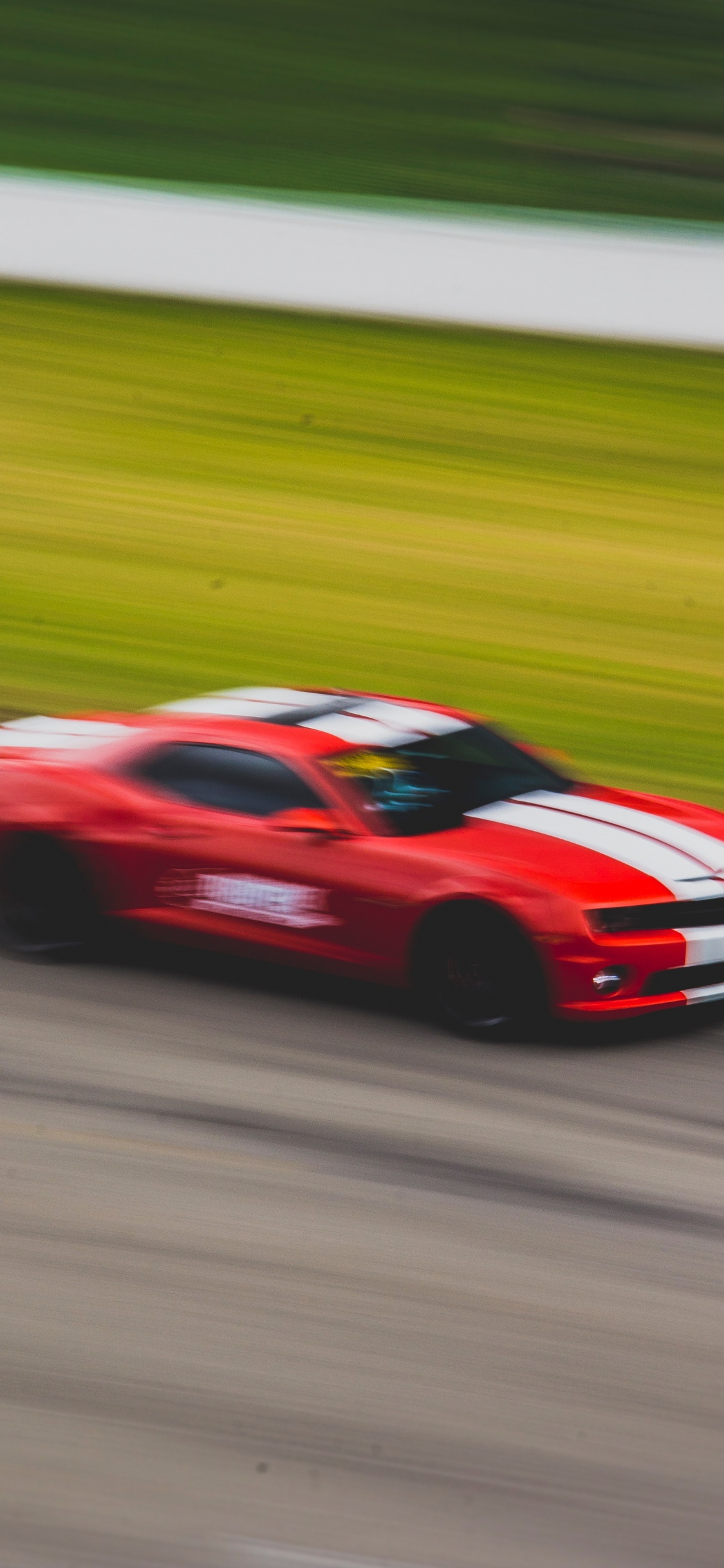 Red Ferrari 458 Italia on Road. Wallpaper in 1125x2436 Resolution