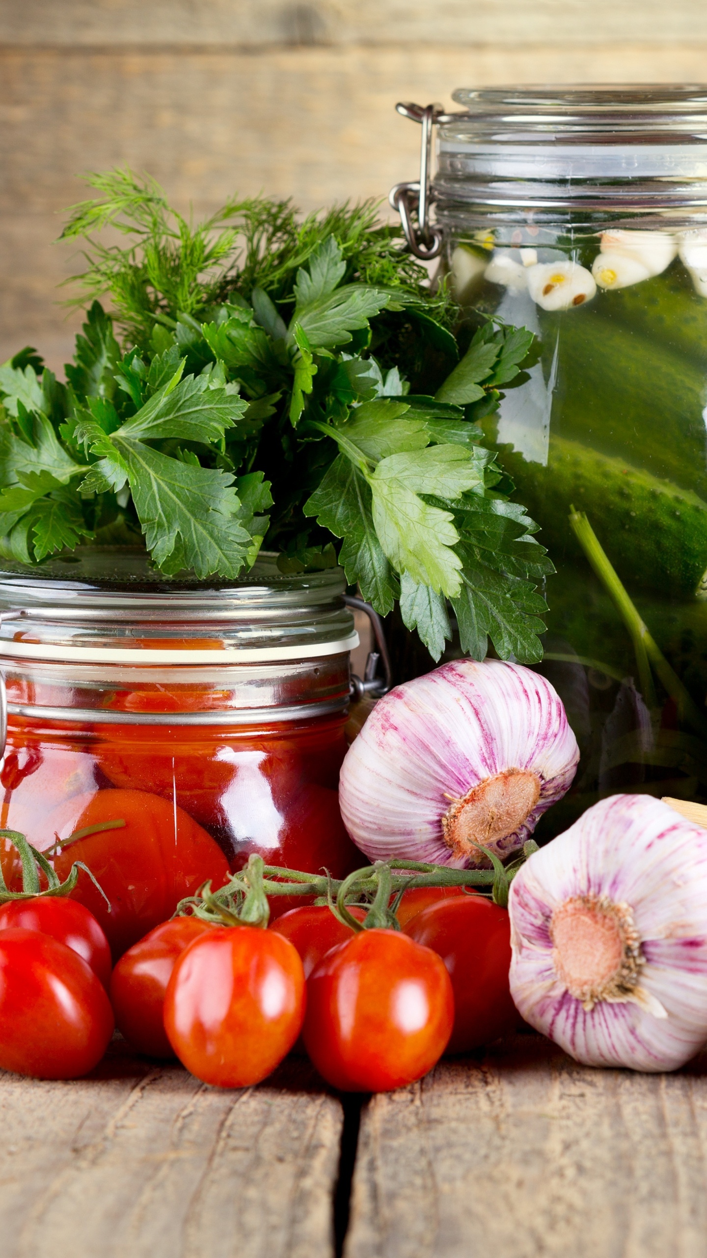 Red Tomatoes and Green Leaves in Clear Glass Jar. Wallpaper in 1440x2560 Resolution