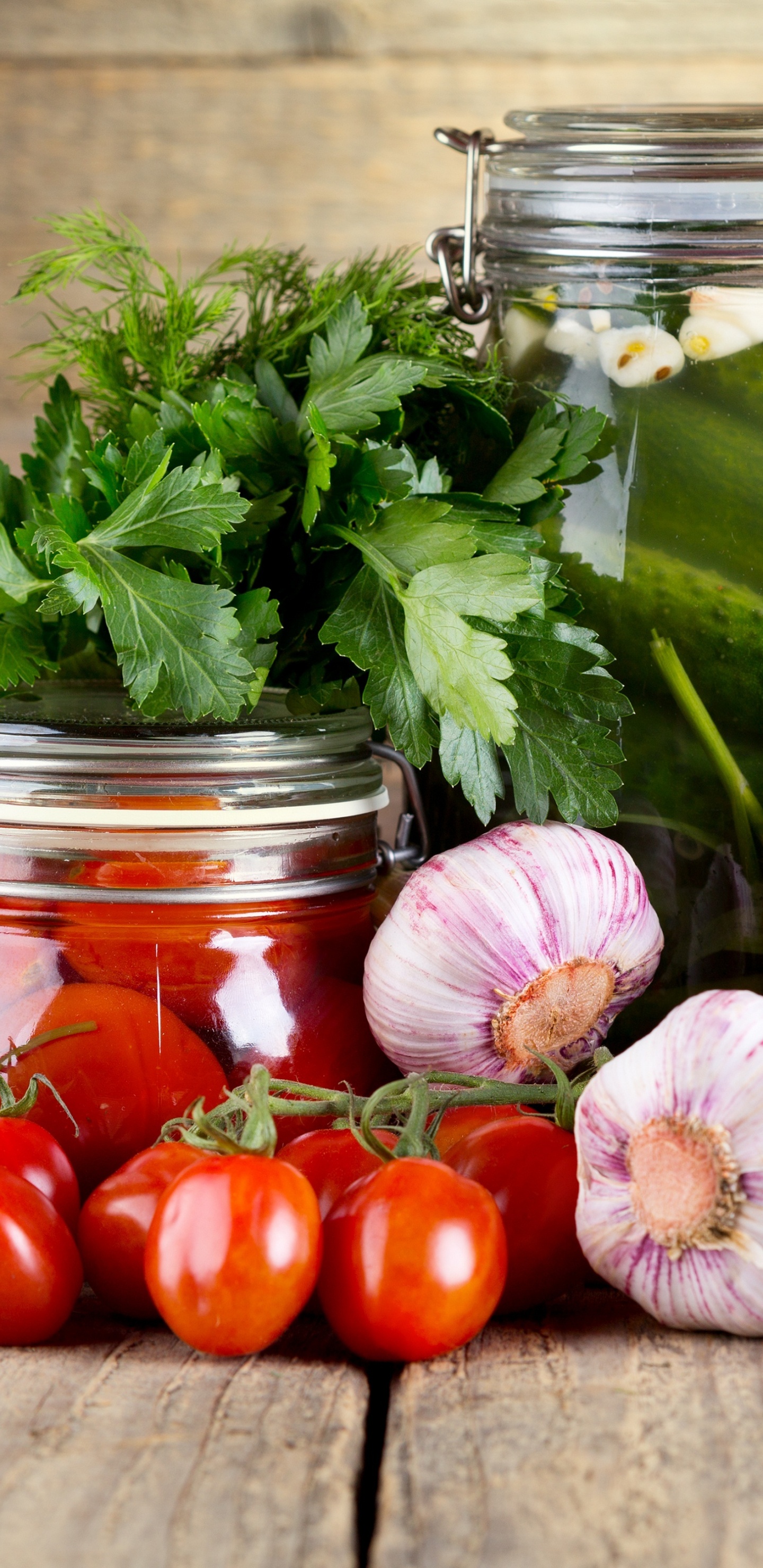 Red Tomatoes and Green Leaves in Clear Glass Jar. Wallpaper in 1440x2960 Resolution
