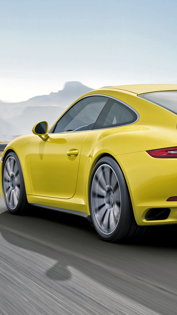 Gelber Porsche 911 Tagsüber Unterwegs. Wallpaper in 720x1280 Resolution