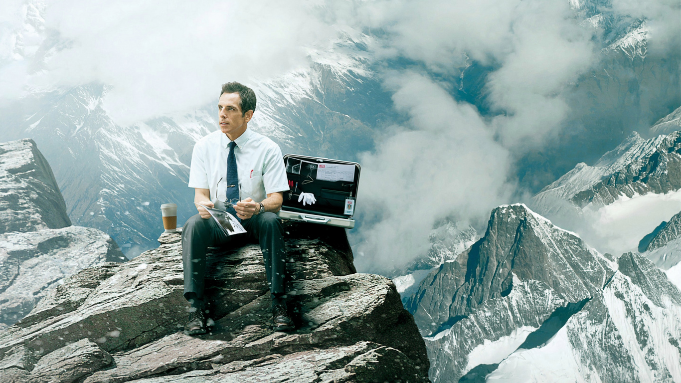 Man in White Dress Shirt Sitting on Rock Formation During Daytime. Wallpaper in 1366x768 Resolution