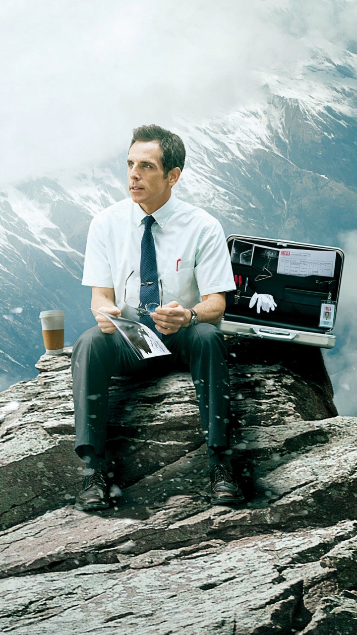 Man in White Dress Shirt Sitting on Rock Formation During Daytime. Wallpaper in 720x1280 Resolution