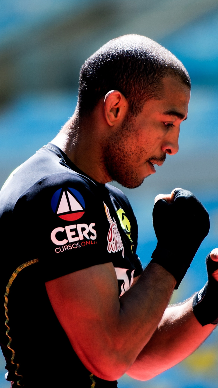 Man in Black and Red Jersey Shirt. Wallpaper in 750x1334 Resolution