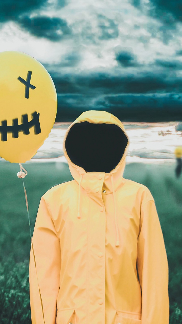 Man in Yellow Hoodie Standing on Green Grass Field During Daytime. Wallpaper in 720x1280 Resolution