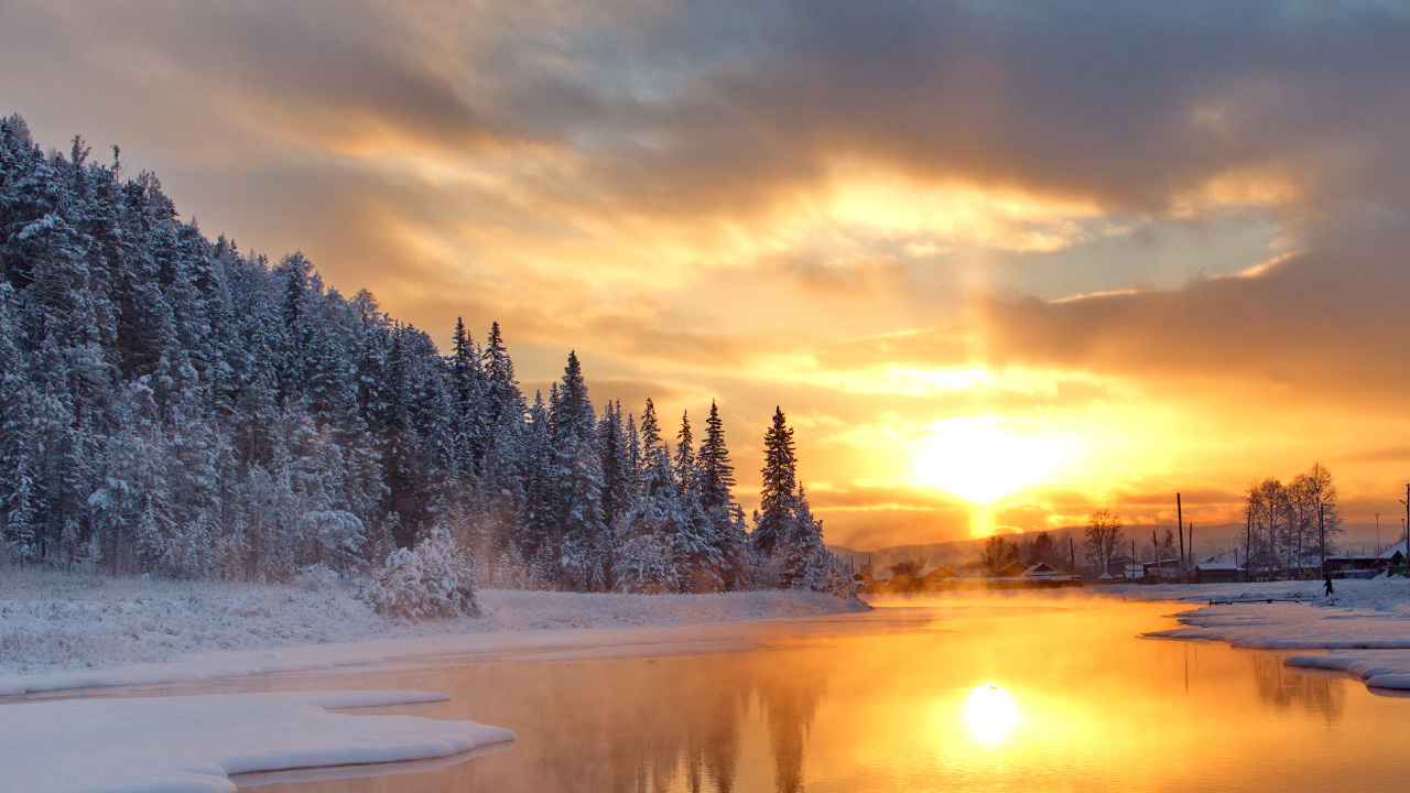 Snow Covered Trees Near Body of Water During Sunset. Wallpaper in 1280x720 Resolution