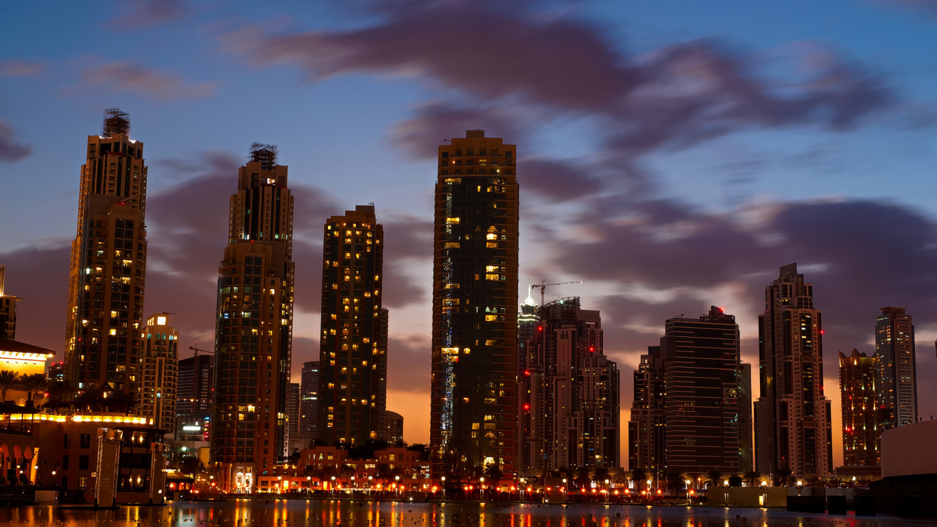 City Skyline Across Body of Water During Night Time. Wallpaper in 1366x768 Resolution