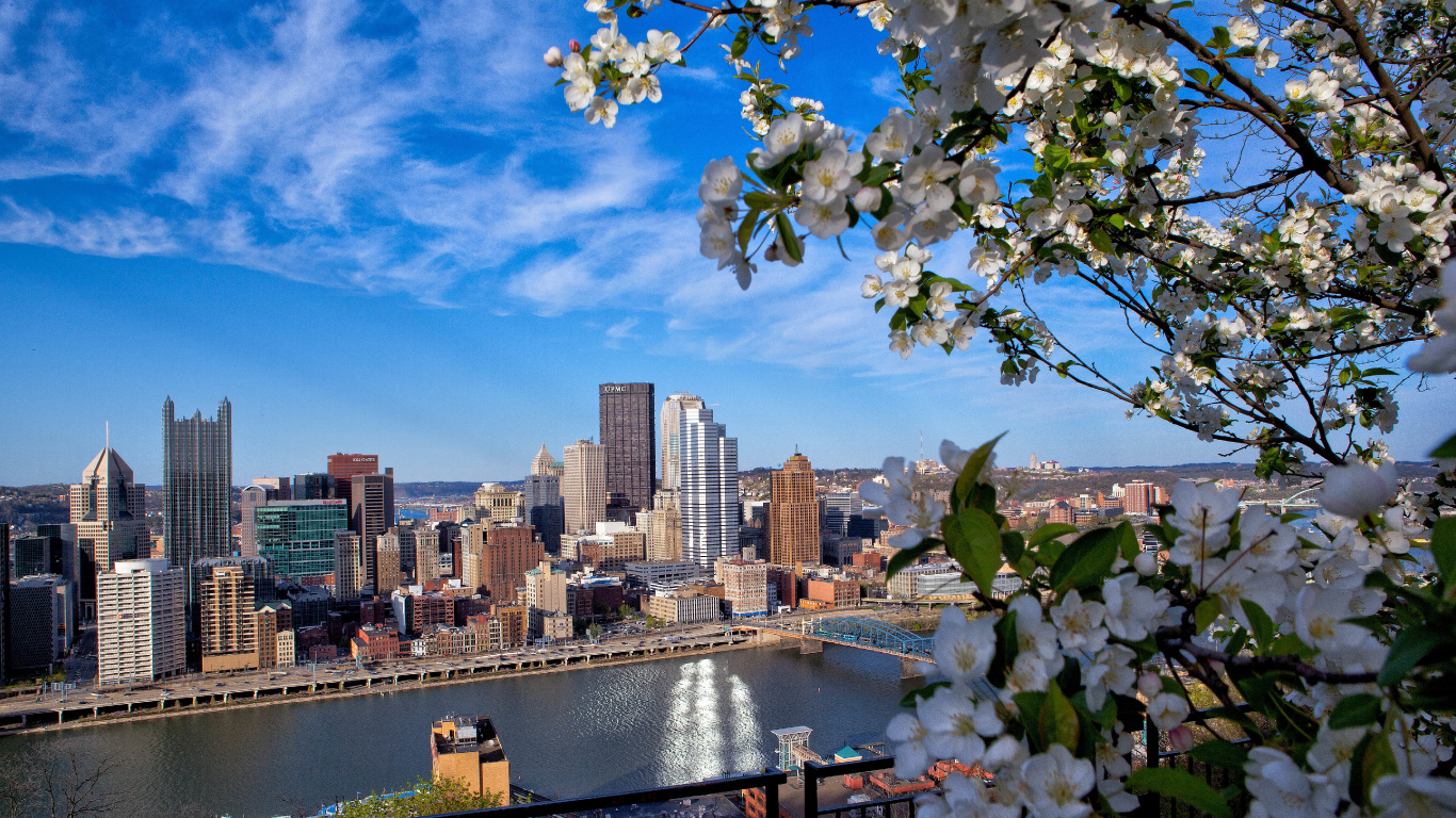 City Skyline Under Blue Sky and White Clouds During Daytime. Wallpaper in 1366x768 Resolution