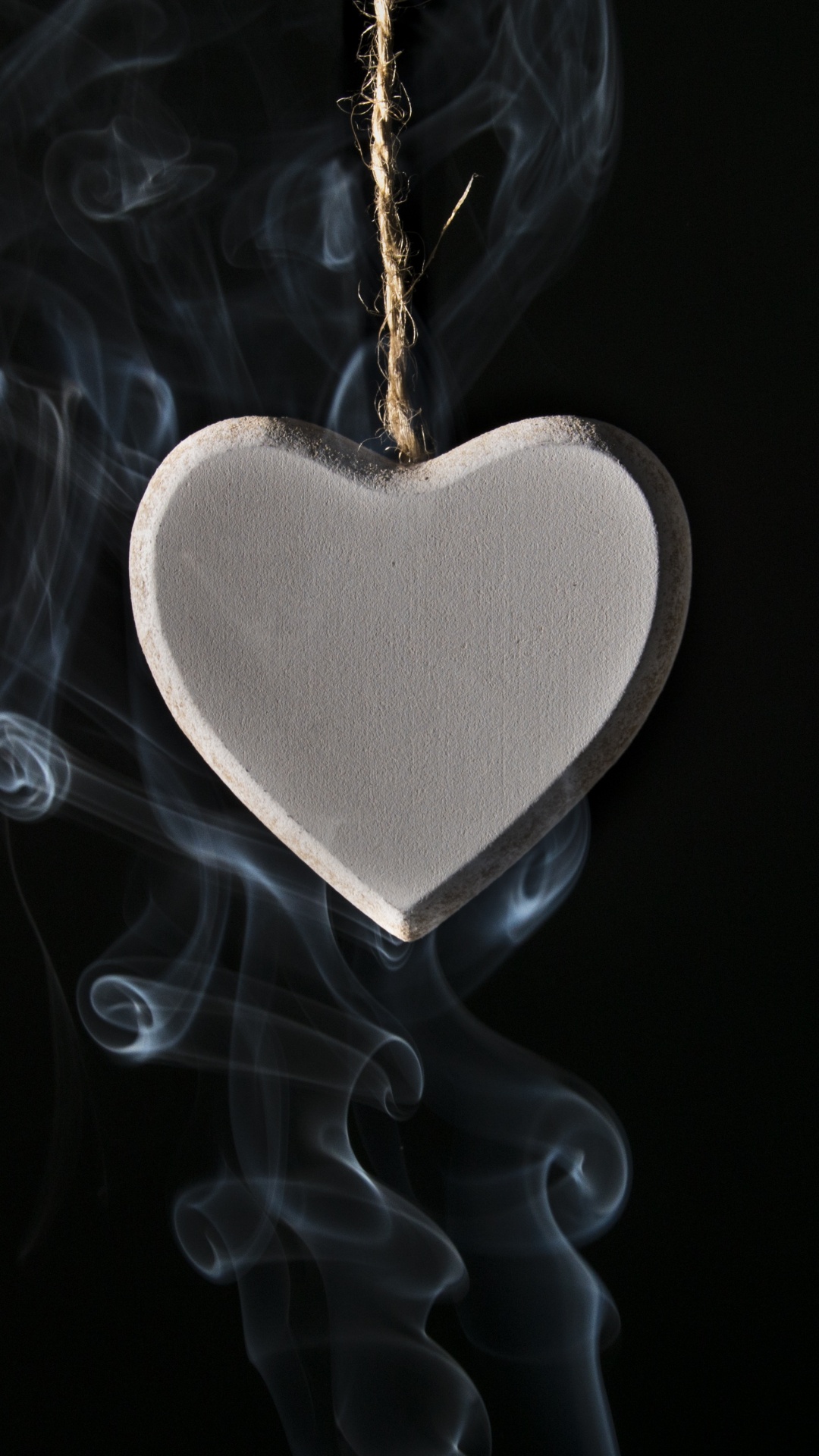 Silver Heart Shape Pendant With White Smoke. Wallpaper in 1080x1920 Resolution
