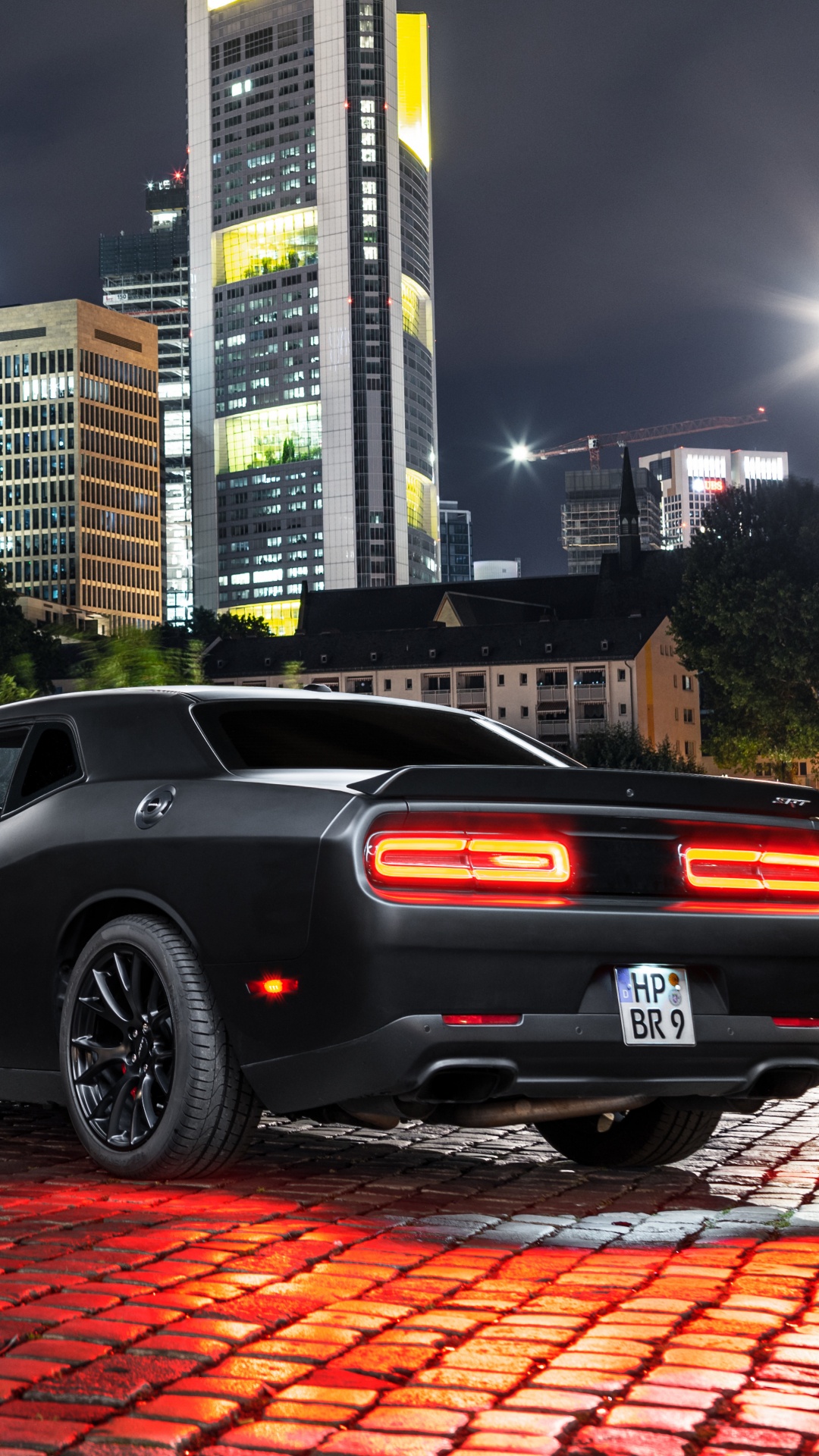 Black Coupe Parked Near Body of Water During Daytime. Wallpaper in 1080x1920 Resolution