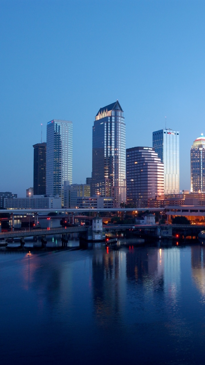City Skyline Across Body of Water During Daytime. Wallpaper in 720x1280 Resolution