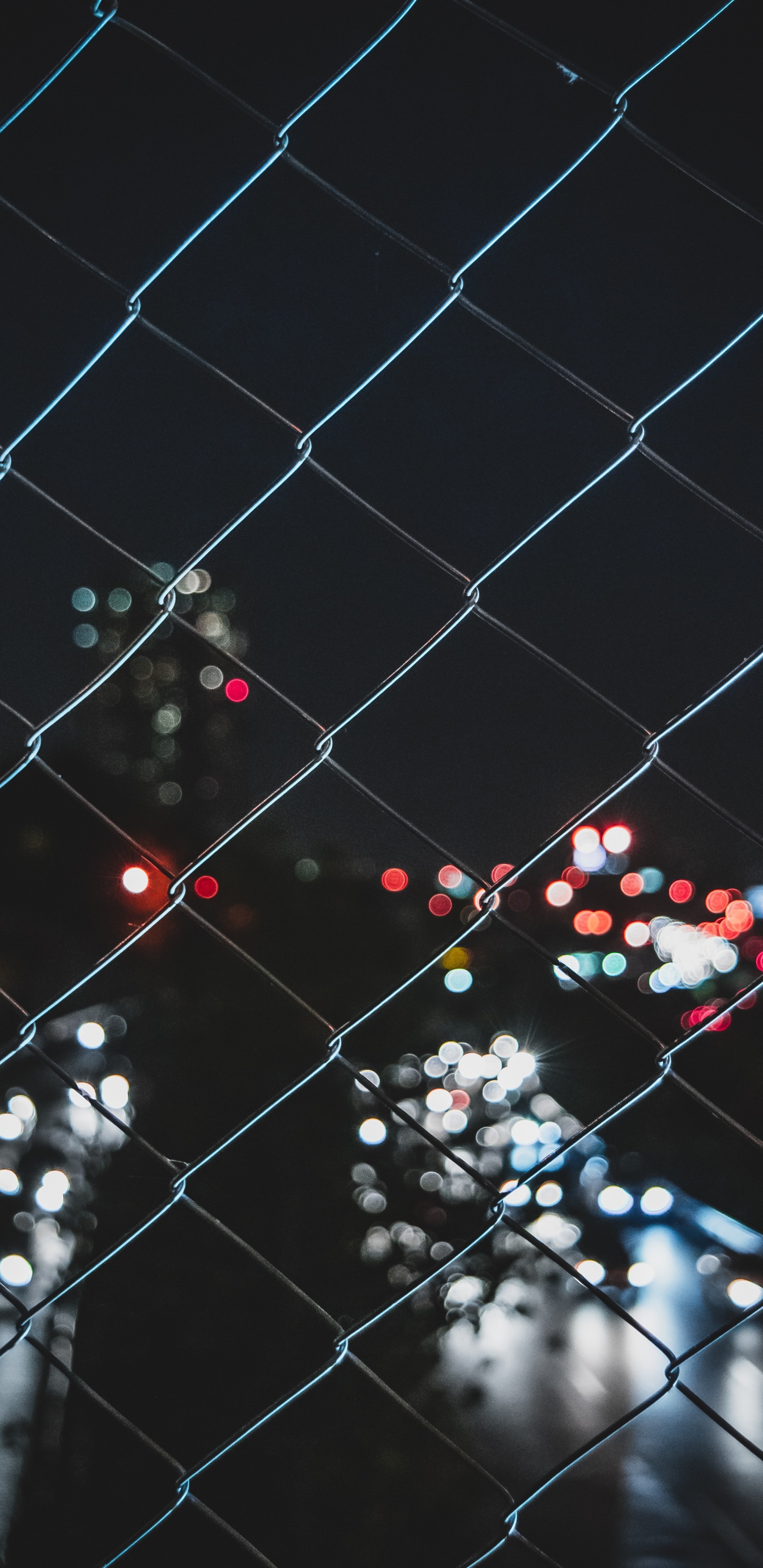 Black and White Polka Dot Pattern on Chain Link Fence. Wallpaper in 1440x2960 Resolution
