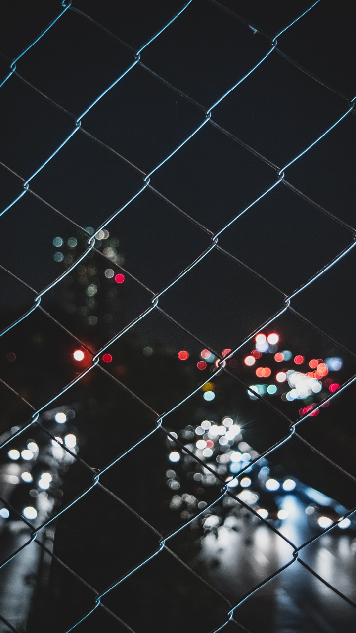Black and White Polka Dot Pattern on Chain Link Fence. Wallpaper in 720x1280 Resolution