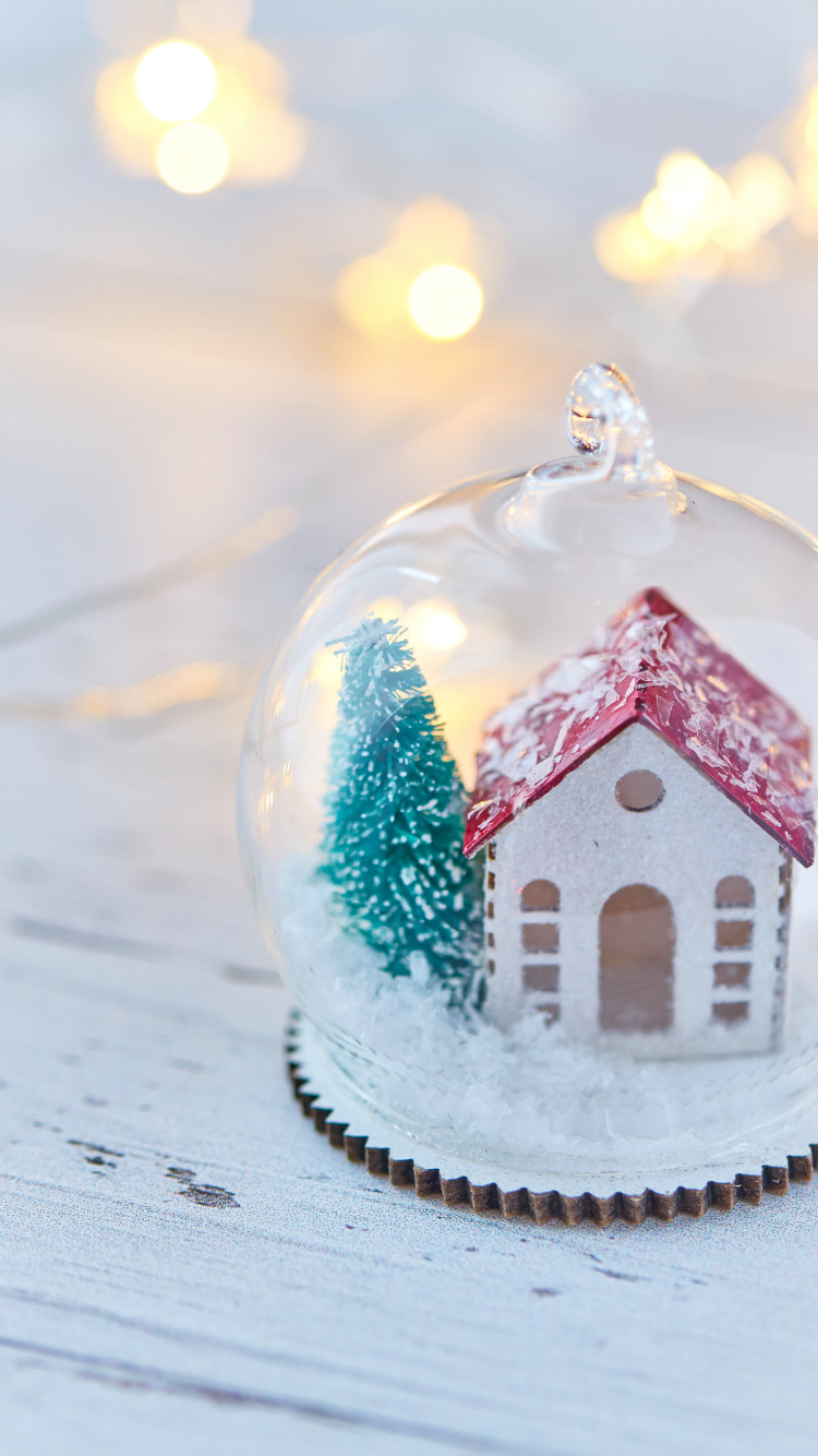 Red and White House Snow Globe. Wallpaper in 750x1334 Resolution