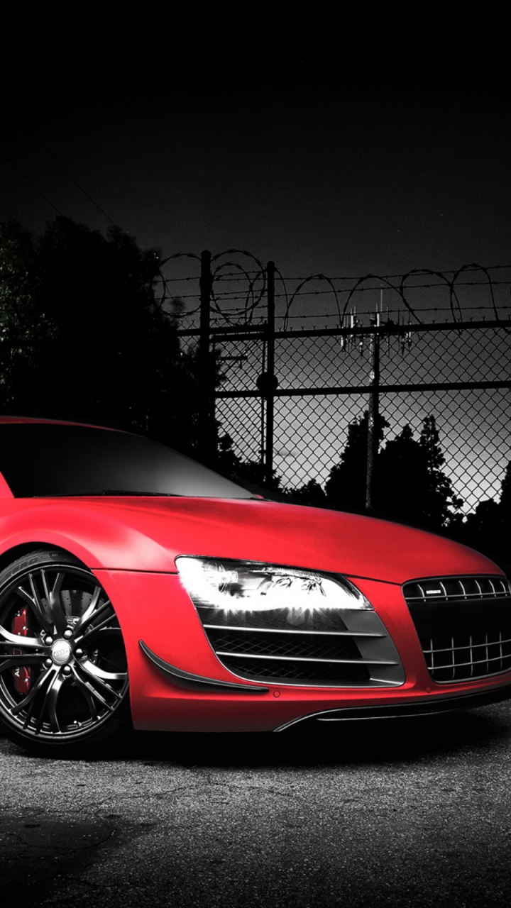 Red Porsche 911 Parked Near Chain Link Fence. Wallpaper in 720x1280 Resolution