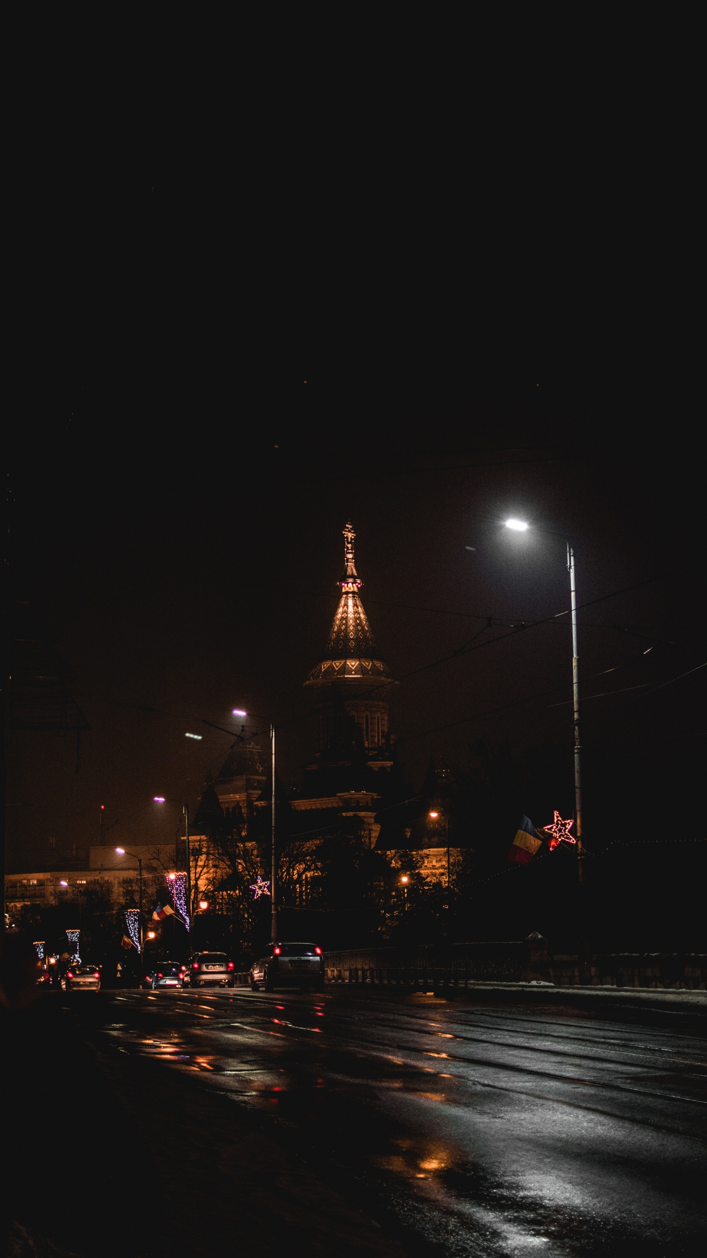 Cars on Road Near Building During Night Time. Wallpaper in 1440x2560 Resolution