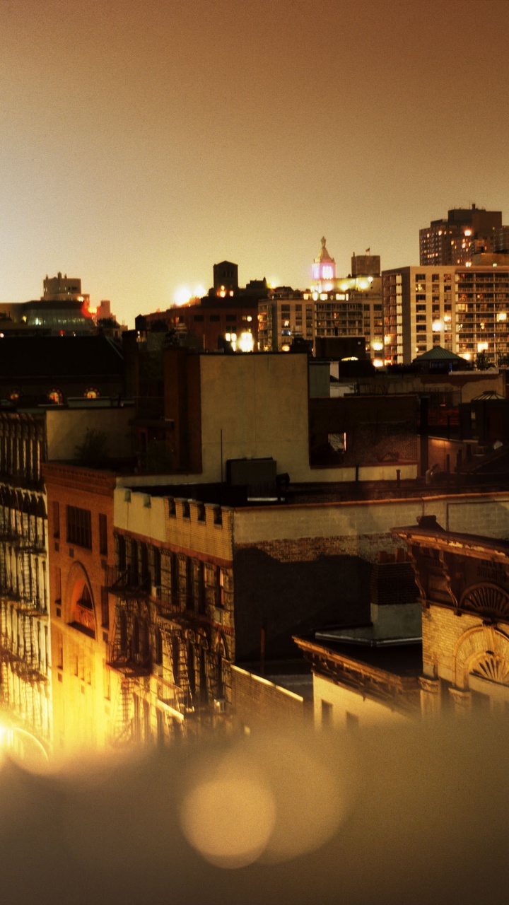 City With High Rise Buildings During Night Time. Wallpaper in 720x1280 Resolution
