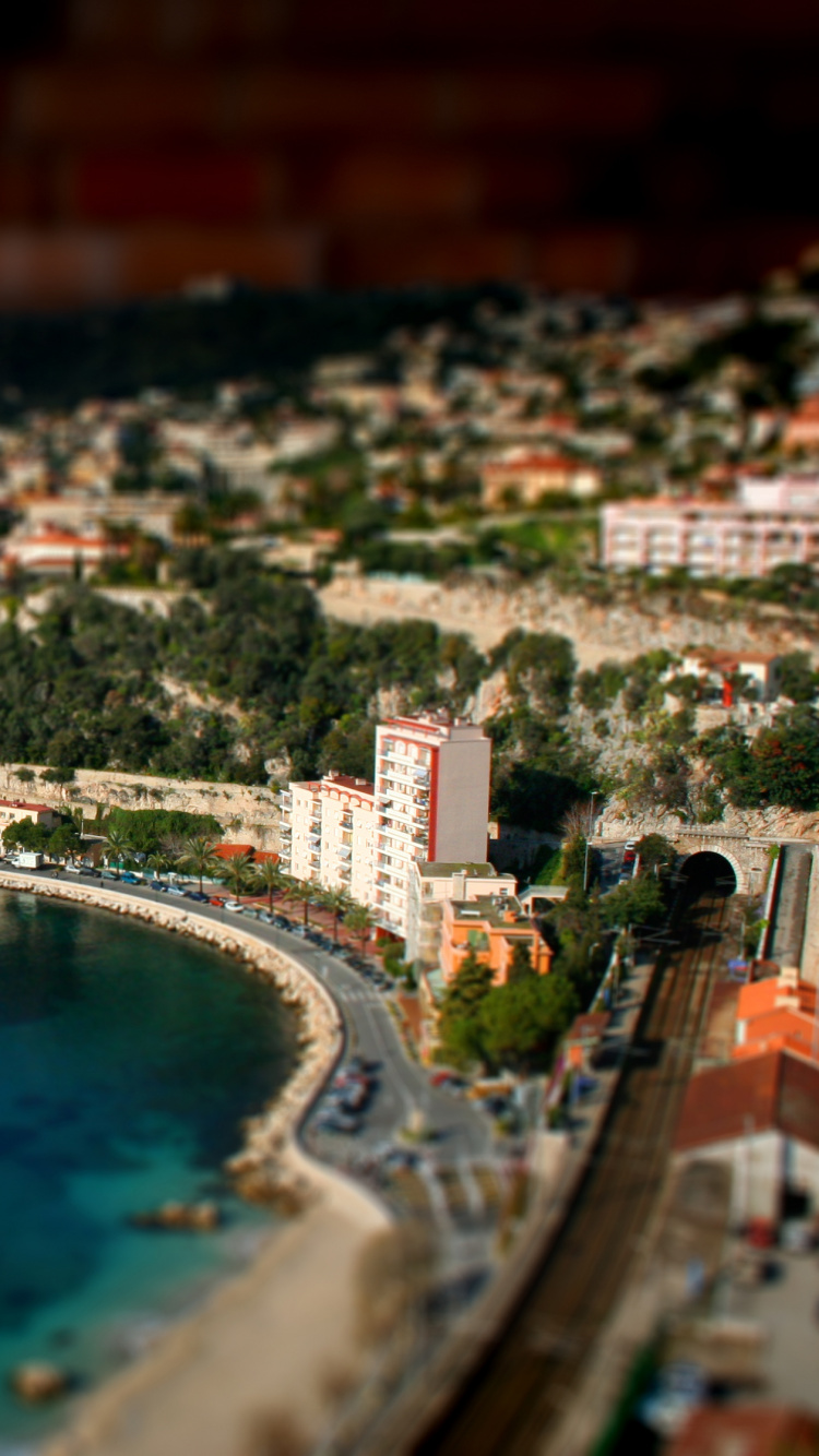 Aerial View of City Buildings Near Body of Water During Daytime. Wallpaper in 750x1334 Resolution