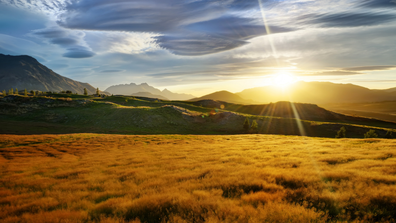 Green Grass Field Near Mountain Under Blue Sky During Daytime. Wallpaper in 1280x720 Resolution