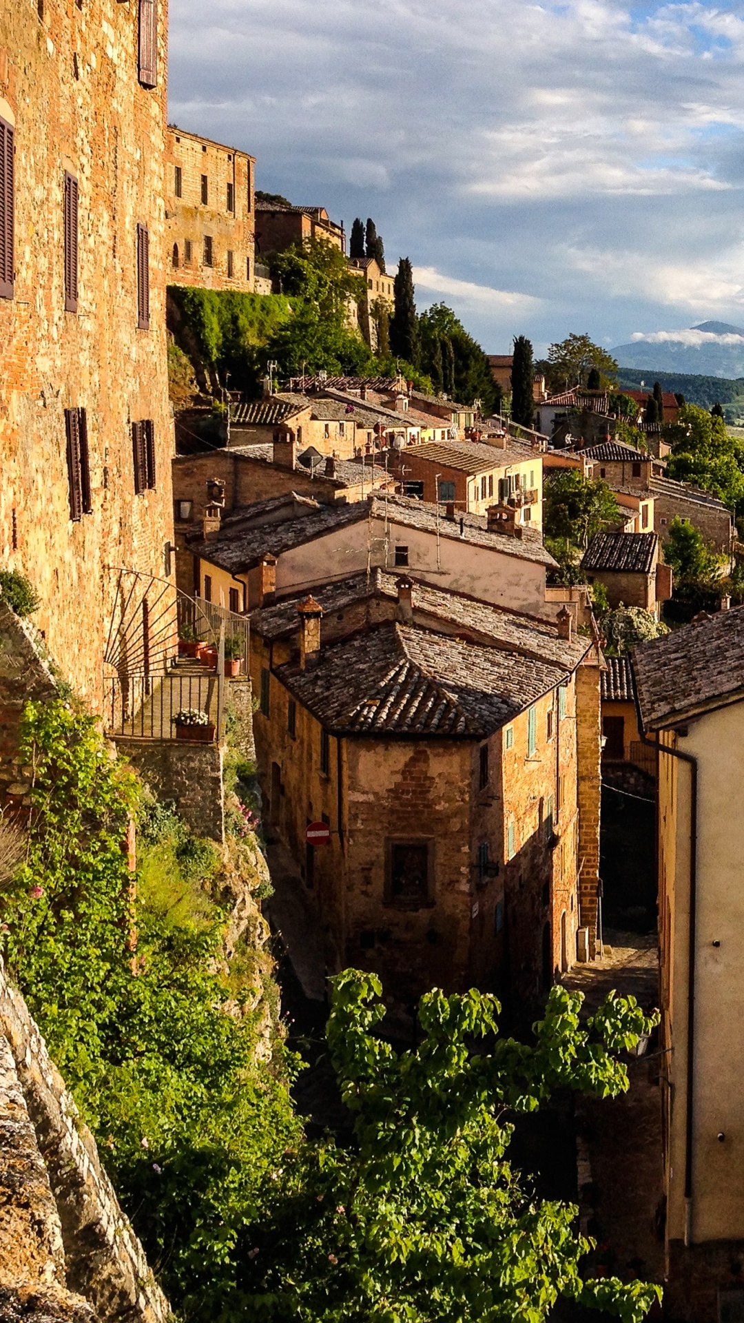 Brown Concrete Building Near Green Trees Under White Clouds During Daytime. Wallpaper in 1080x1920 Resolution