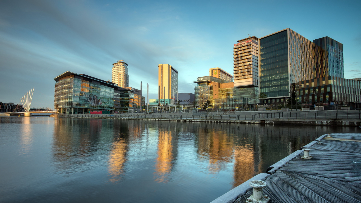 City Skyline Across Body of Water During Daytime. Wallpaper in 1366x768 Resolution
