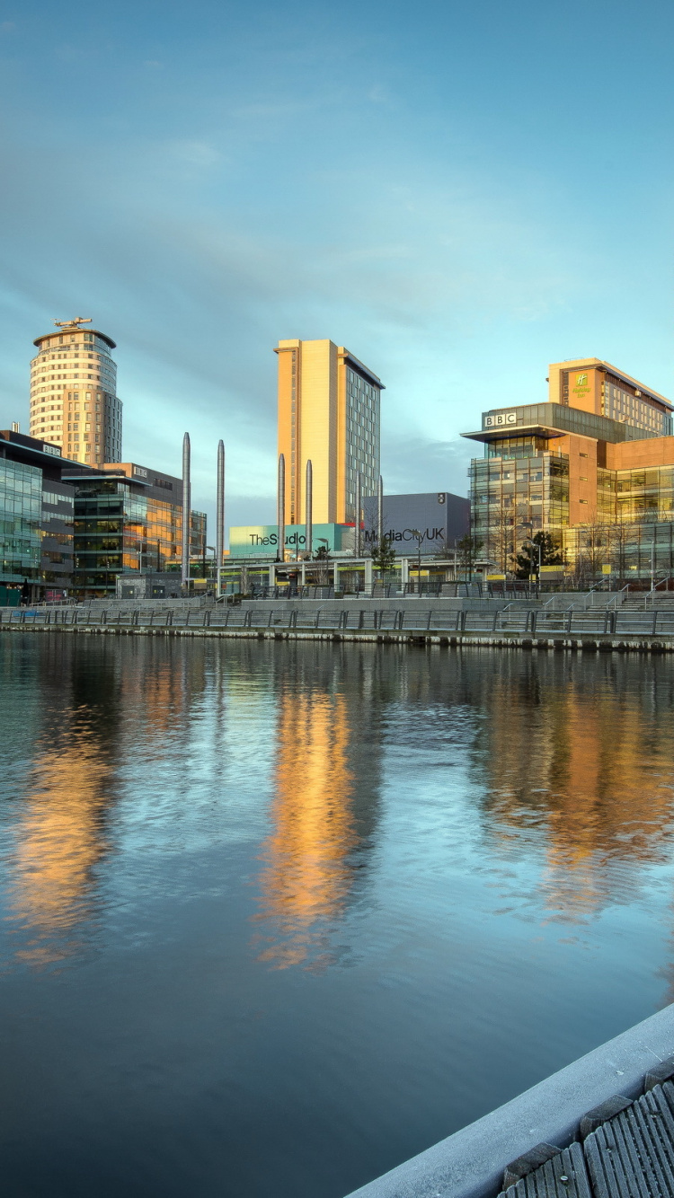 City Skyline Across Body of Water During Daytime. Wallpaper in 750x1334 Resolution