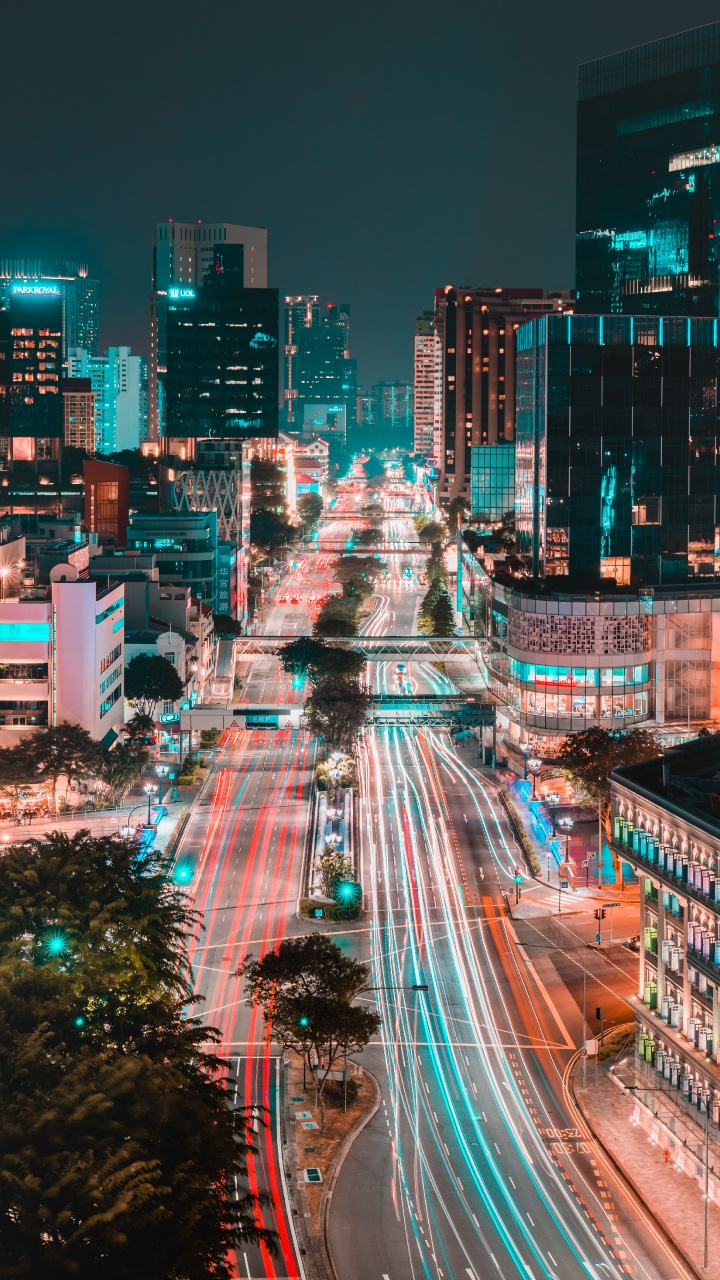 Edificios de la Ciudad Durante la Noche.. Wallpaper in 720x1280 Resolution