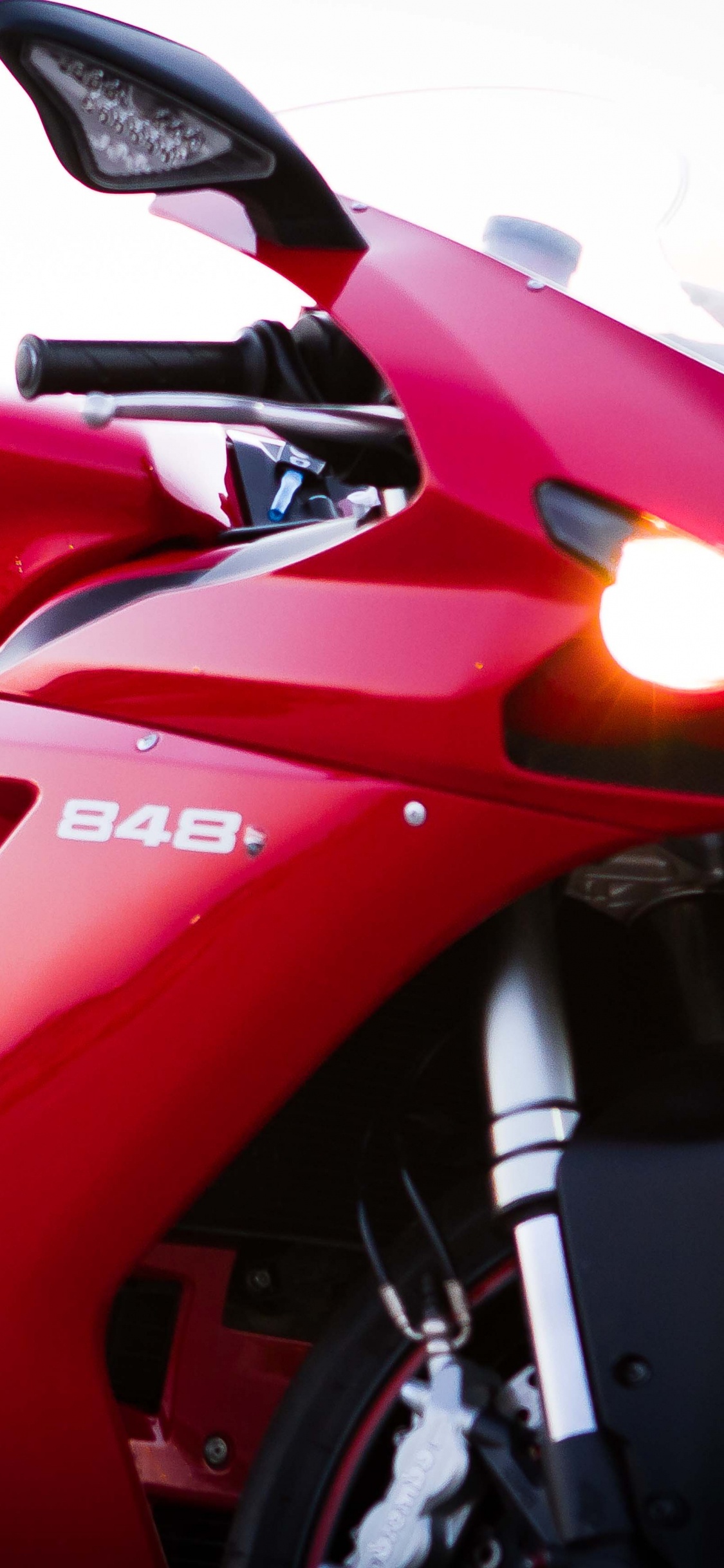 Red and Black Sports Bike. Wallpaper in 1125x2436 Resolution
