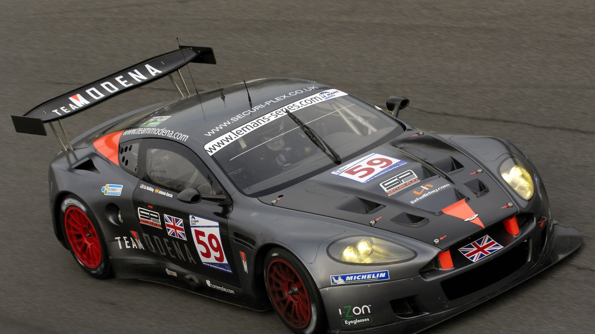 Schwarz-roter Porsche 911 Auf Grauer Asphaltstraße. Wallpaper in 1920x1080 Resolution