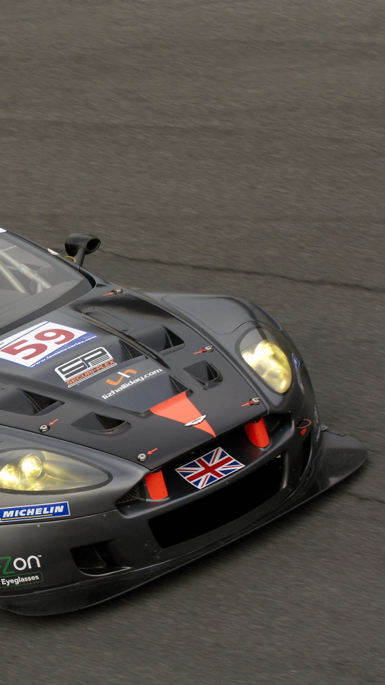 Schwarz-roter Porsche 911 Auf Grauer Asphaltstraße. Wallpaper in 750x1334 Resolution