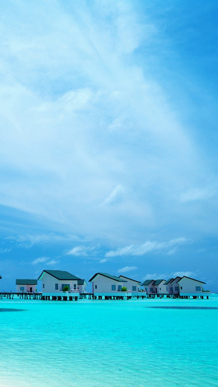 Blue Body of Water Under Blue Sky and White Clouds During Daytime. Wallpaper in 750x1334 Resolution