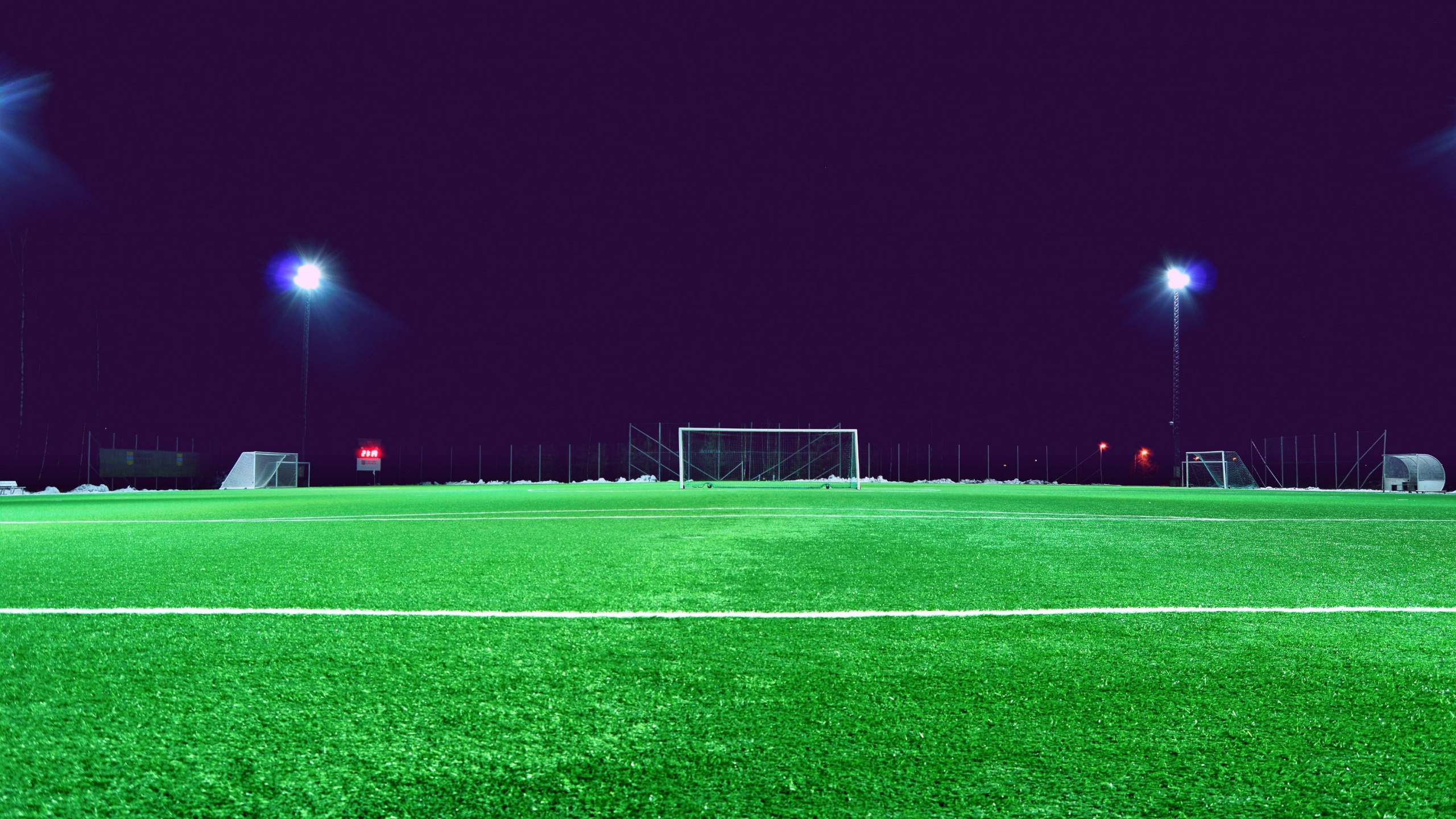 Soccer Goal Net on Green Field During Night Time. Wallpaper in 2560x1440 Resolution