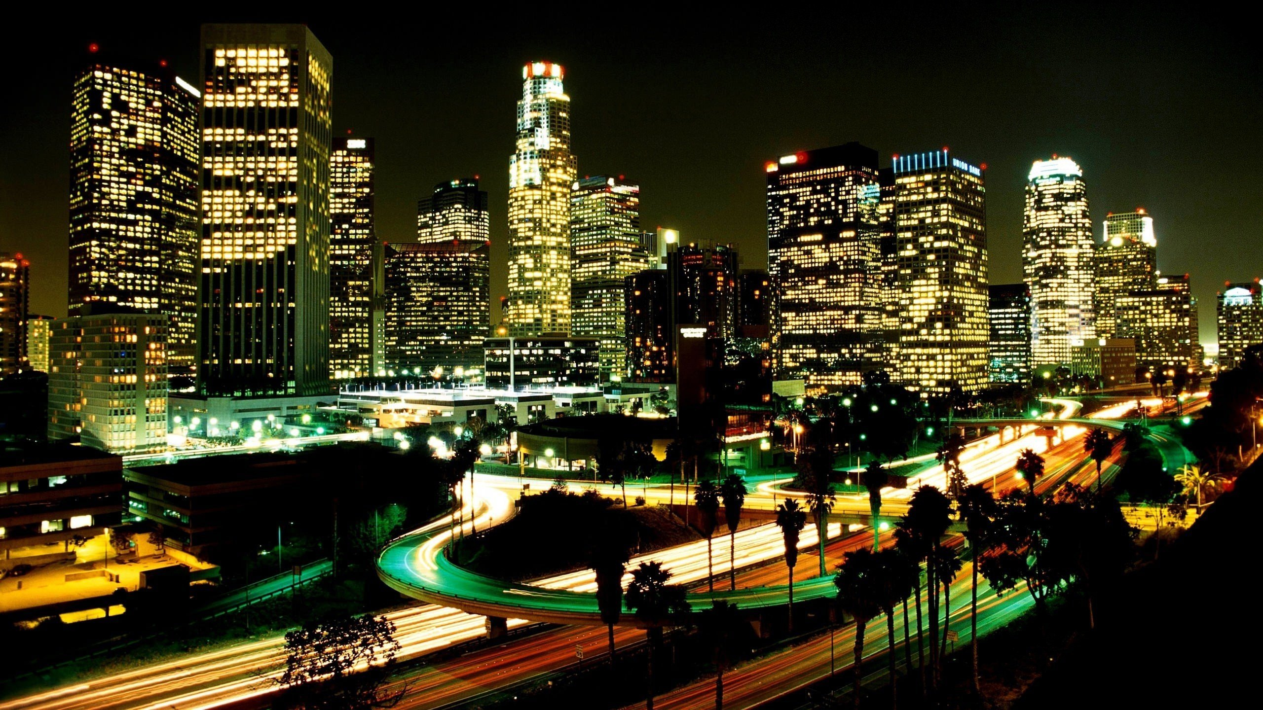 City Buildings During Night Time. Wallpaper in 2560x1440 Resolution
