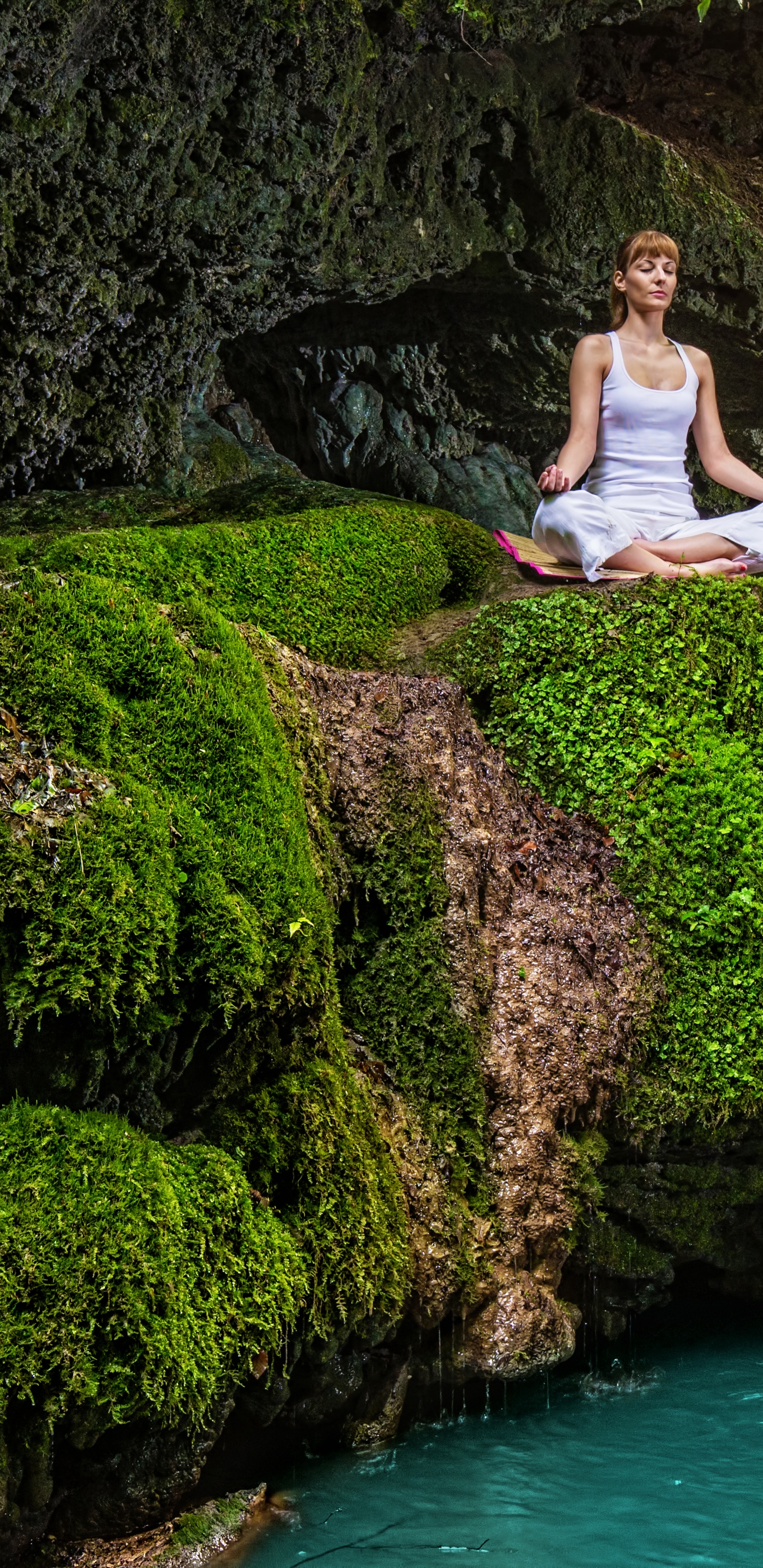 Woman in White Tank Top and Black Pants Sitting on Rock Near Waterfalls During Daytime. Wallpaper in 1440x2960 Resolution