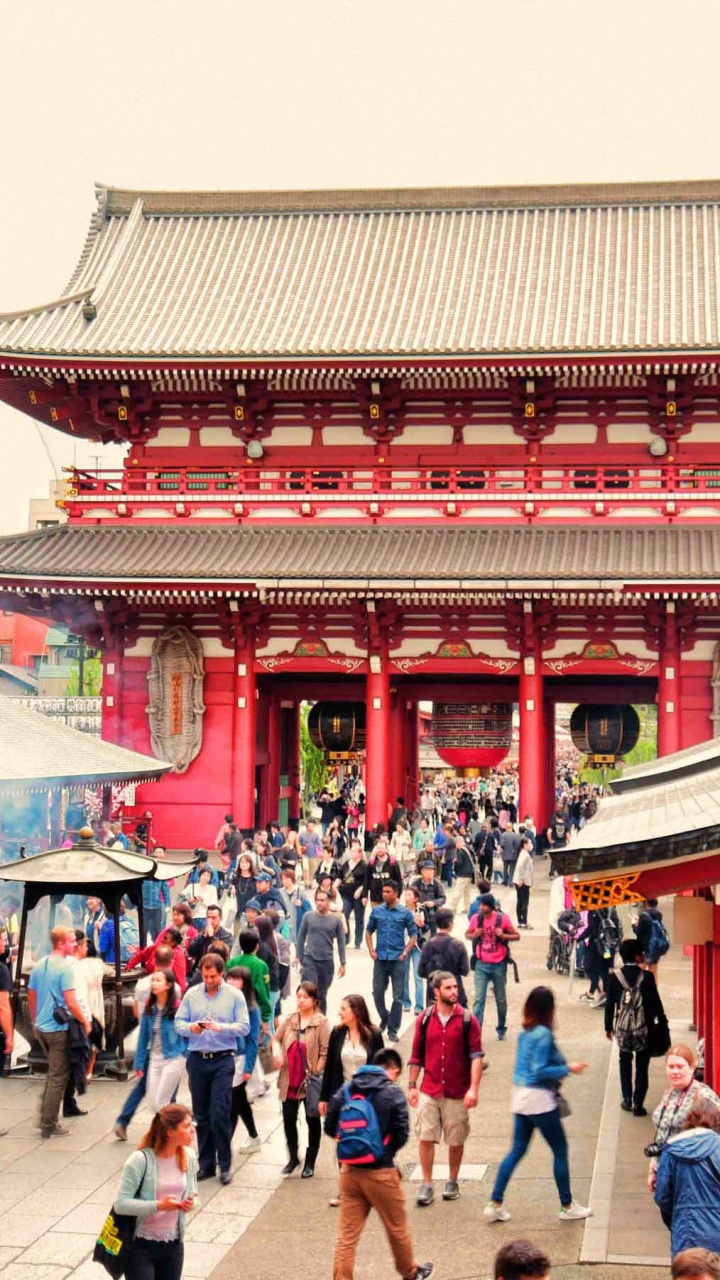 People Walking on Street Near Red and White Temple During Daytime. Wallpaper in 720x1280 Resolution