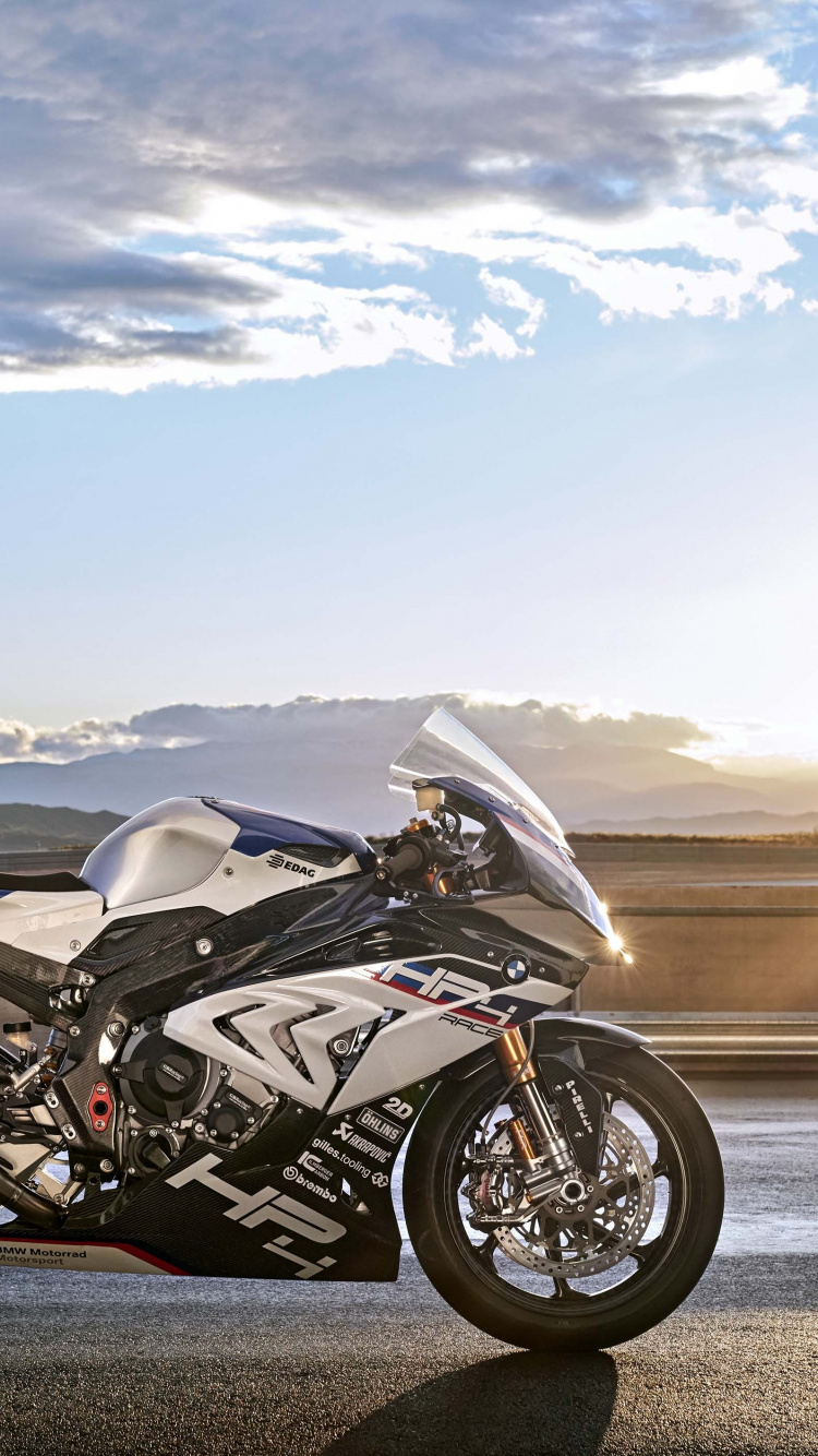 Black and Silver Sports Bike on Gray Asphalt Road During Daytime. Wallpaper in 750x1334 Resolution