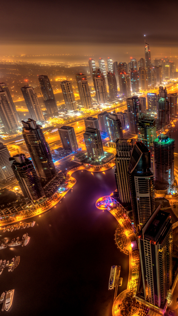 Aerial View of City Buildings During Night Time. Wallpaper in 750x1334 Resolution