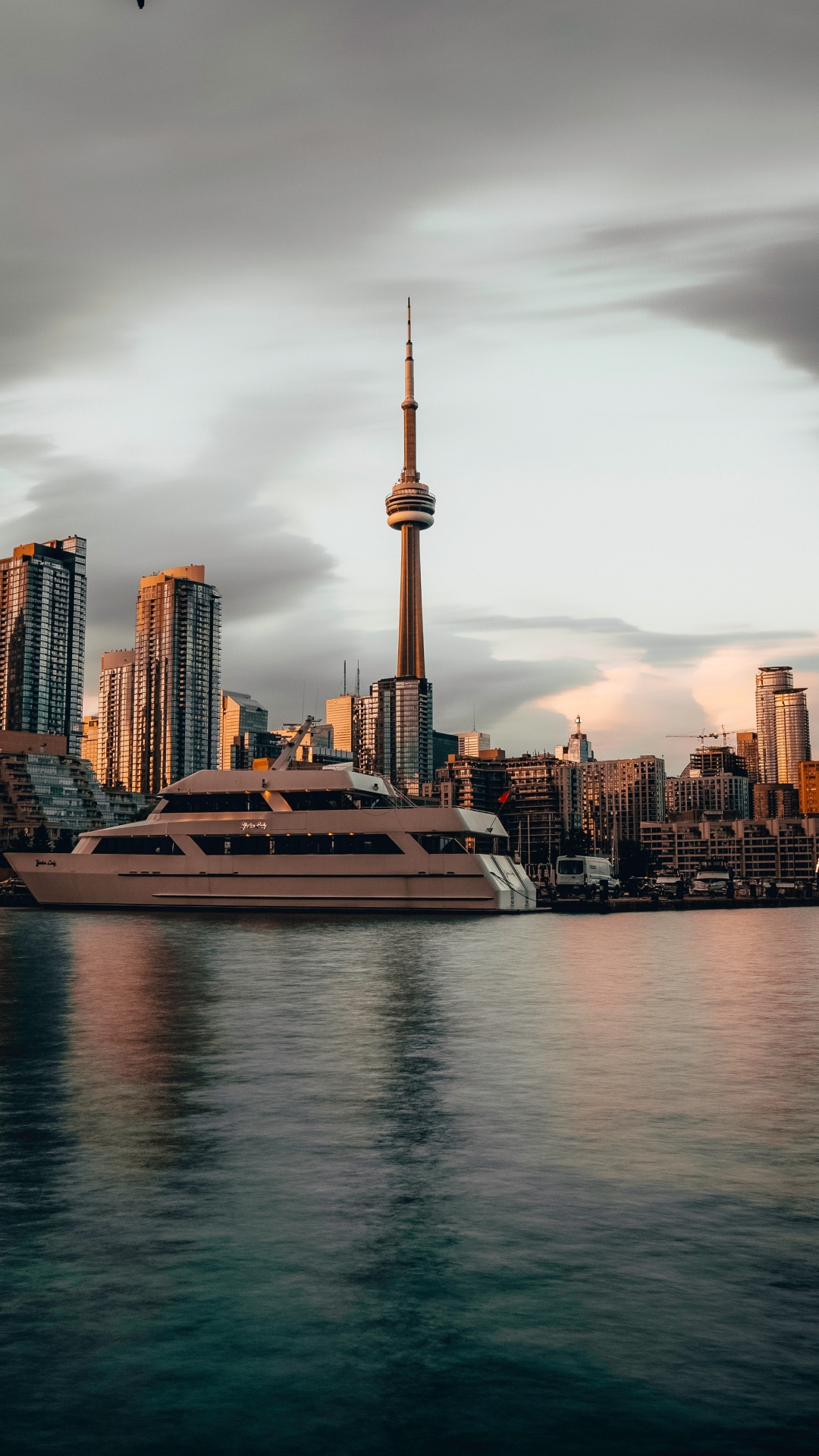 City Skyline Across Body of Water During Daytime. Wallpaper in 1080x1920 Resolution