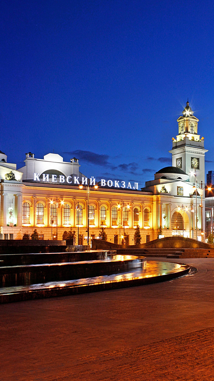 White and Brown Concrete Building During Night Time. Wallpaper in 750x1334 Resolution