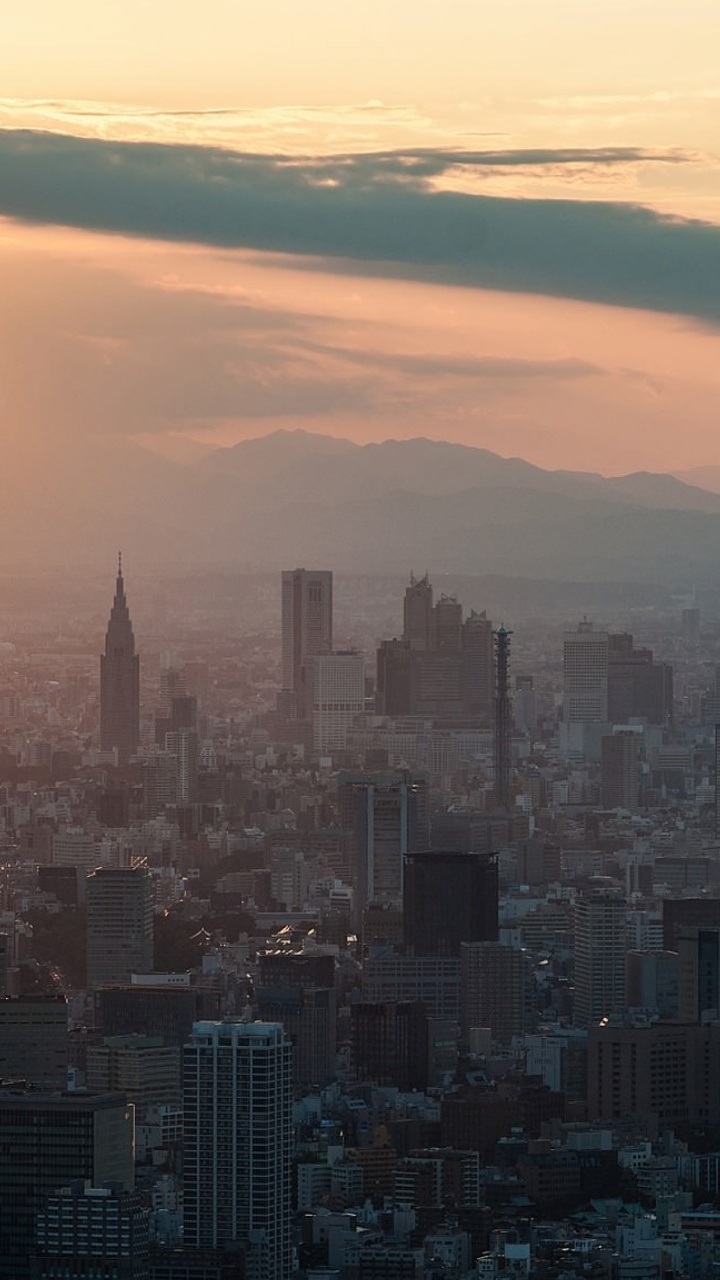 Vista Aérea de Los Edificios de la Ciudad Durante la Puesta de Sol. Wallpaper in 720x1280 Resolution