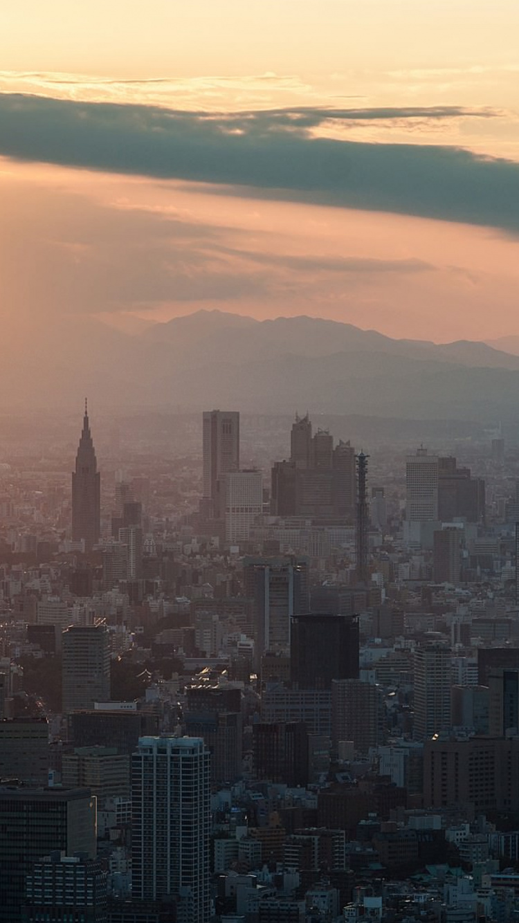 Vista Aérea de Los Edificios de la Ciudad Durante la Puesta de Sol. Wallpaper in 750x1334 Resolution