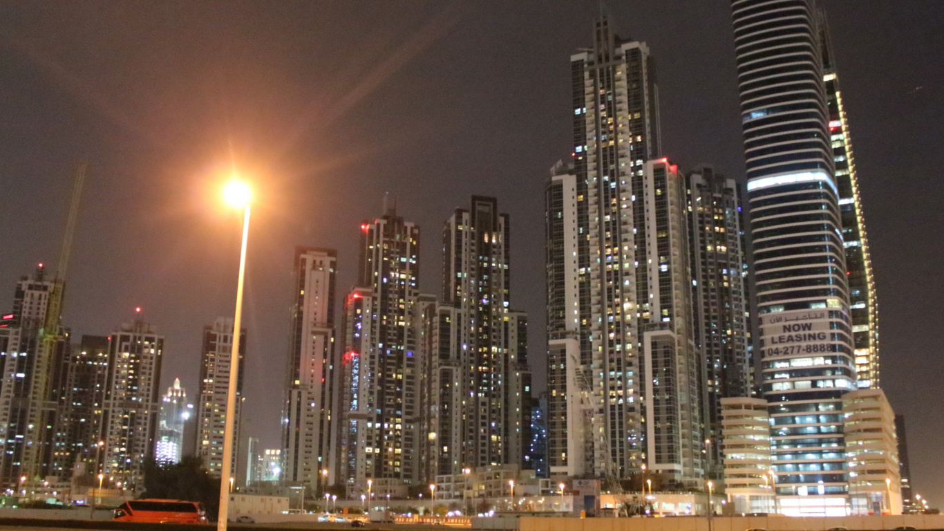 City Buildings During Night Time. Wallpaper in 1366x768 Resolution
