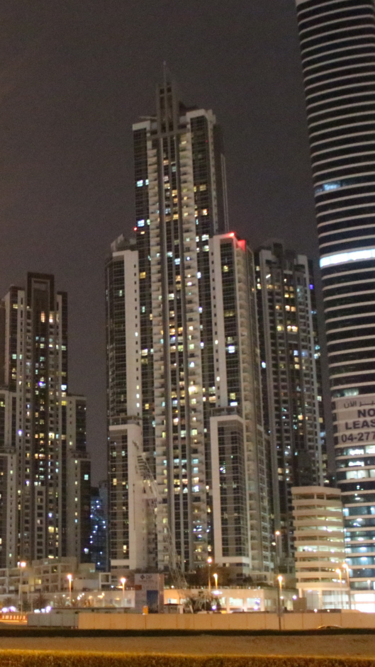 City Buildings During Night Time. Wallpaper in 750x1334 Resolution